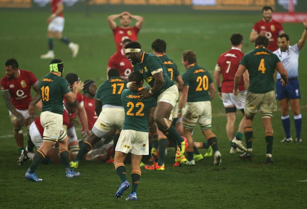 South Africa captain Siya Kolisi celebrates with Morne Steyn following the third Test against the British & Irish Lions on August 7, 2021 (MB Media/Getty Images)